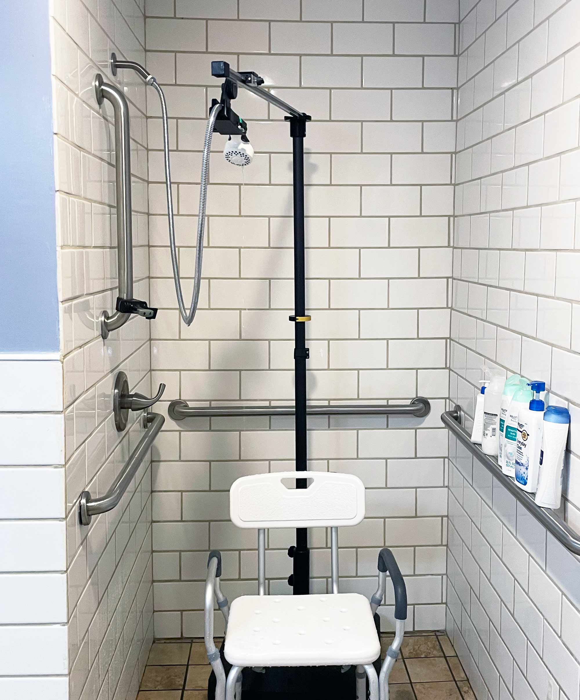 The Aide-ing Arm shower chair attachment